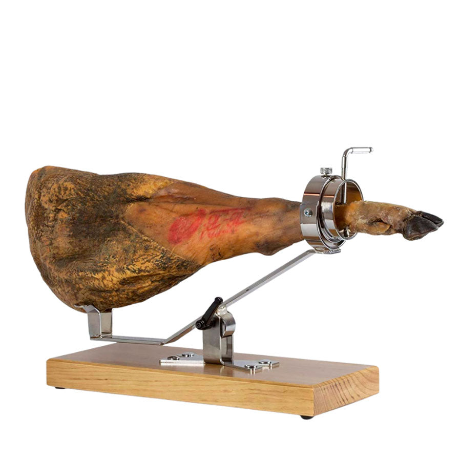 jamonero profesional con base de madera nogal y estructura en acero inoxidable basculante y giratorio con jamón agarrado