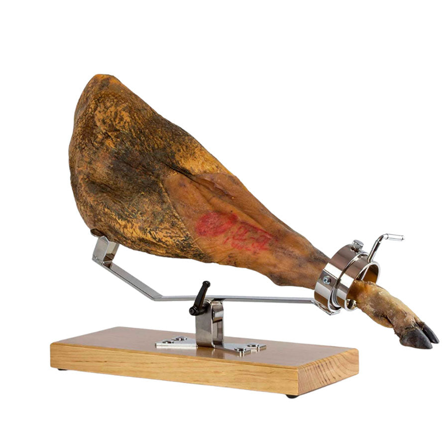 jamonero profesional con base de madera nogal y estructura en acero inoxidable basculante y giratorio con jamón inclinado